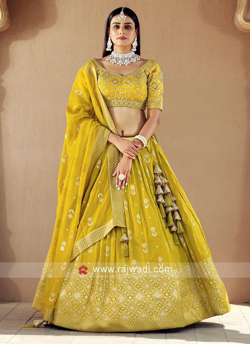 breathtaking lemon yellow color embroidered lehenga choli 52021