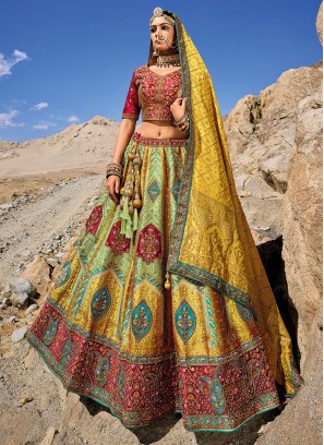 Invaluable Yellow And Pista Green Embroidered Banarasi Silk Lehenga Choli