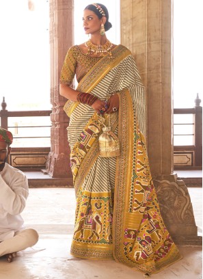 Classic Yellow And Cream Festive Patola Printed Silk Saree