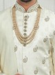 Brocade Silk Anarkali Style Groom Sherwani In Cream Color