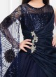 Navy Blue Gown In Net With A One Side Long Cape Sleeves