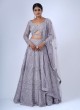 Striking Light Purple Heavy Embroidered Lehenga In Net