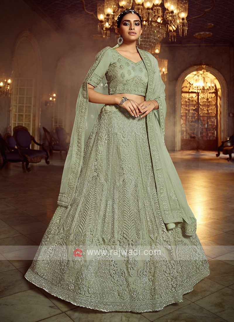 Photo of Light green sabya lehenga for mehendi with pastel jewellery