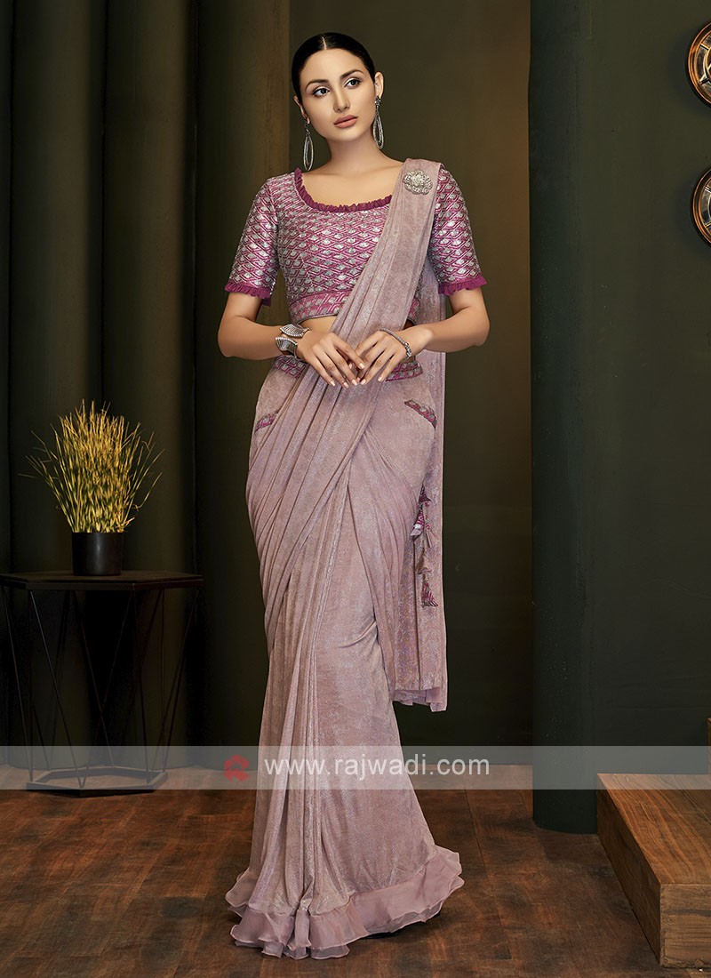 This light pink saree with hand block prints is traditional and graceful.  Muted gold motifs provide a subtle pizazz to the calming pink backdrop.  Wear it and le…