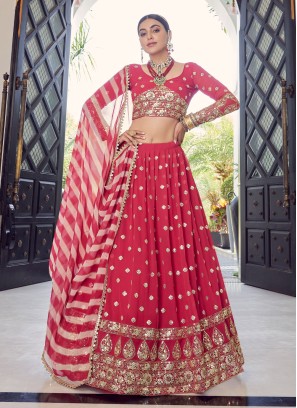 Exquisite Coral Red Georgette Zari Lehenga Choli