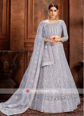 Grey color Lehenga choli with matching dupatta.