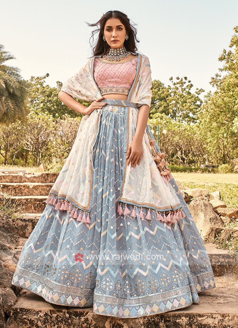 Peach lehenga in raw silk with contrast blouse in french knot and kundan  embroidery only on