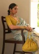 Aqua Blue Organza Saree With Yellow Blouse