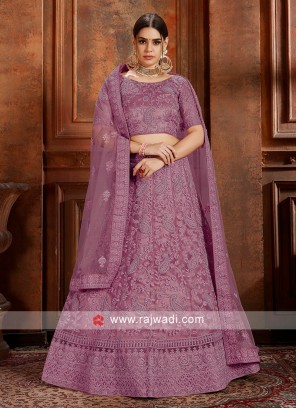 Purple Soft net lehenga Choli with matching dupatta.