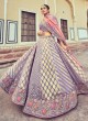 Mesmerizing Purple Woven Silk Wedding Lehenga Choli