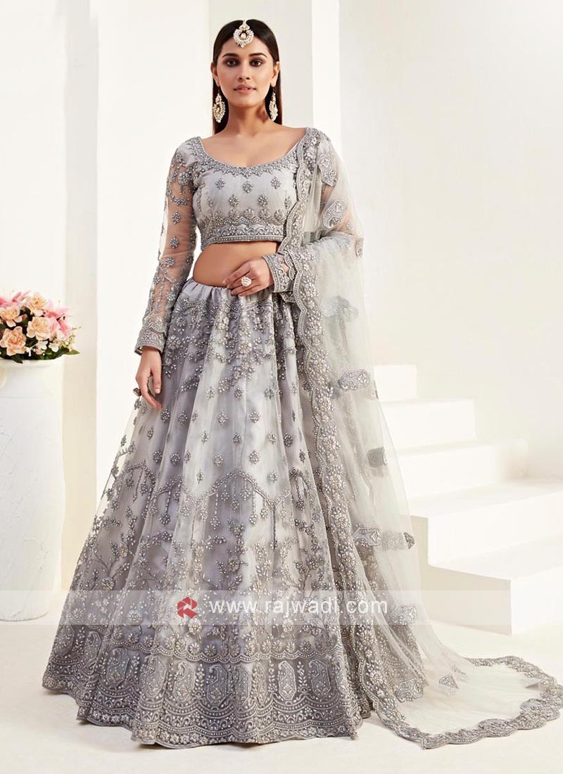 Grey color Lehenga choli with matching dupatta.