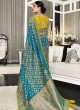 Shimmering Teal and Yellow Zari Embellished Silk Saree