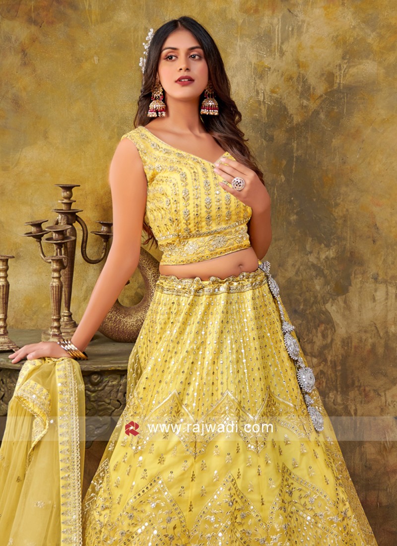 Yellow lehenga choli on sale designs for engagement